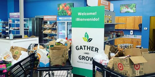 Welcome Sign and Boxes on carts at Gather and Grow Waconia Food Shelf